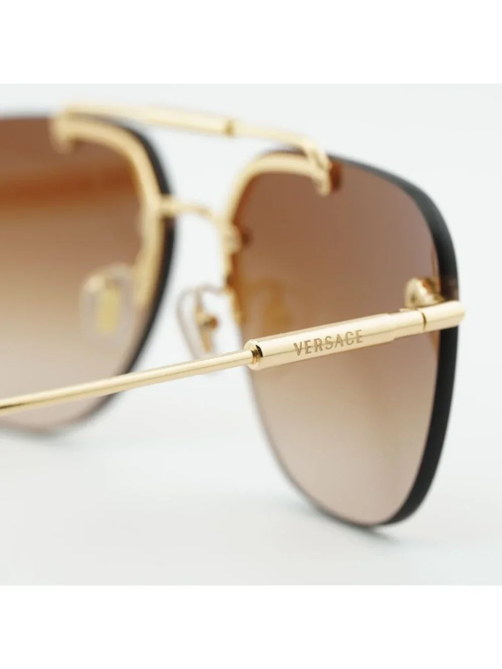 Versace VE2296 100213 Sunglasses Gold Rimless Aviator Frame, Brown Lenses